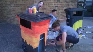 Modified trash can and students