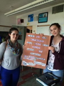 students with handmade sign