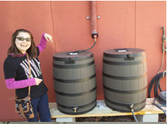 Allison with rain barrels