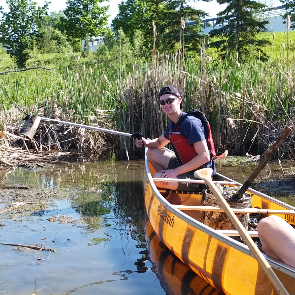 Purgin Sturgeon student action implementation Luke in canoe