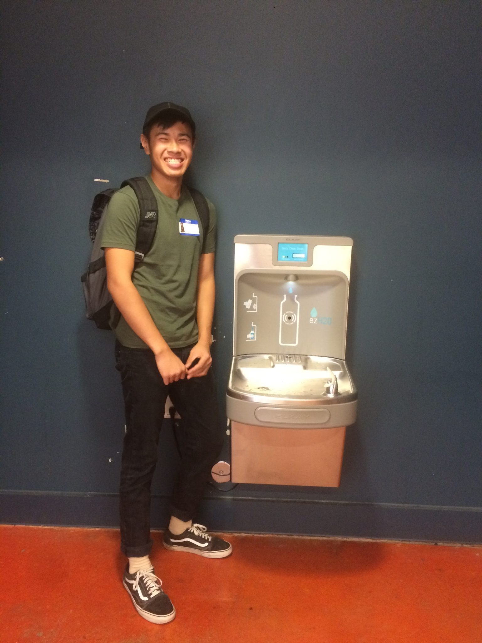 Justin Yu installs water bottle filling station at MET Sacramento High School