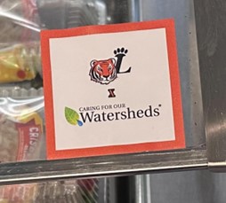 Caring for our watersheds logo on food freezer